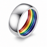 Polished silver ring with rainbow-coloured interior on a white background