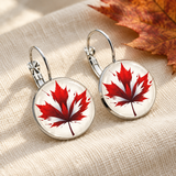 Styled maple-leaf earrings close-up