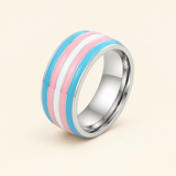 Trans pride ring with light blue, pink and white stripes on an ivory background